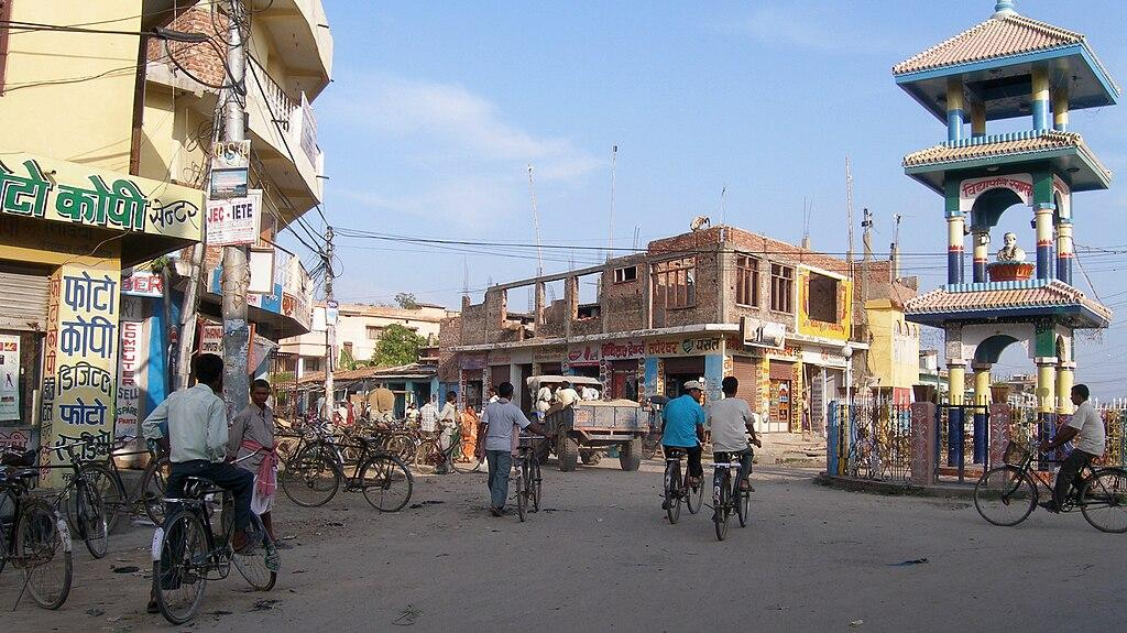 Visitors walking through streets in Janakpur with local markets, shops, and traditional architecture.