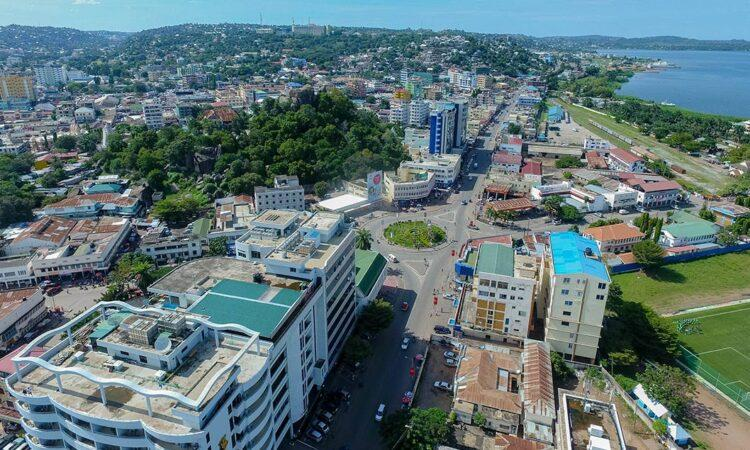 A panoramic aerial view of Mwanza showing the cityscape along the shores of Lake Victoria with surrounding hills in Tanzania.