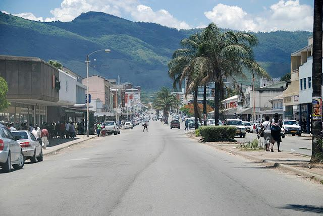 Visitors walking through streets in Mutare with local markets, shops, and pedestrian activity.