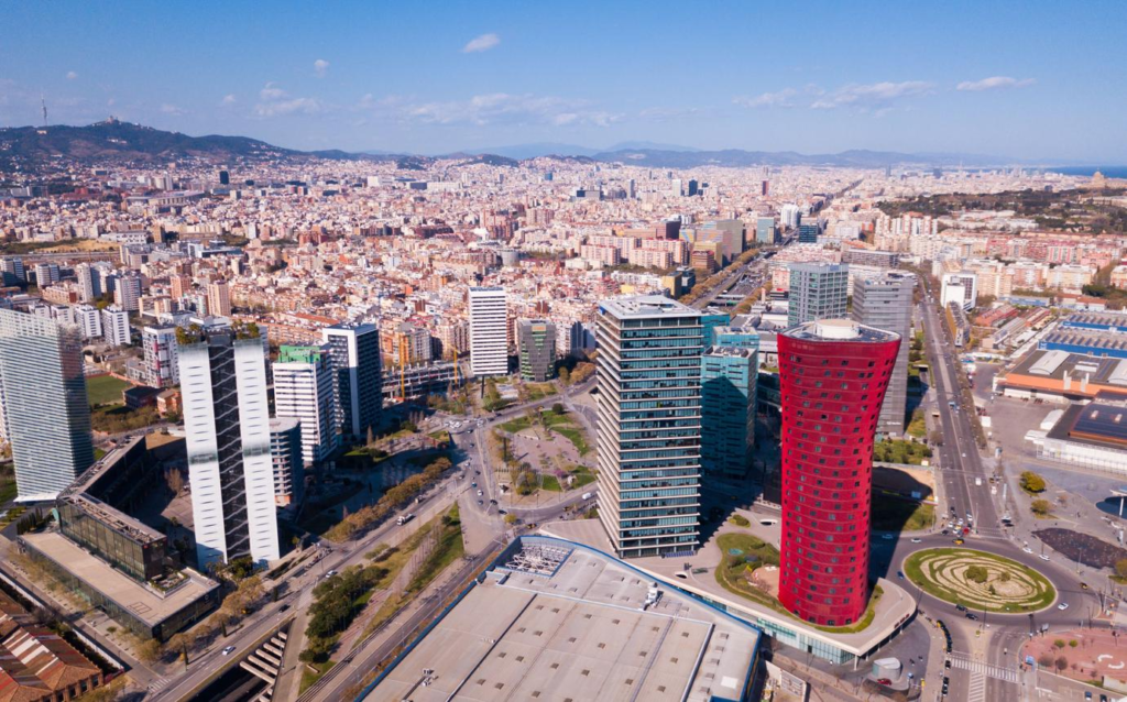 A panoramic aerial view of L’Hospitalet de Llobregat showing the cityscape, urban districts, and Barcelona metropolitan area in Spain.