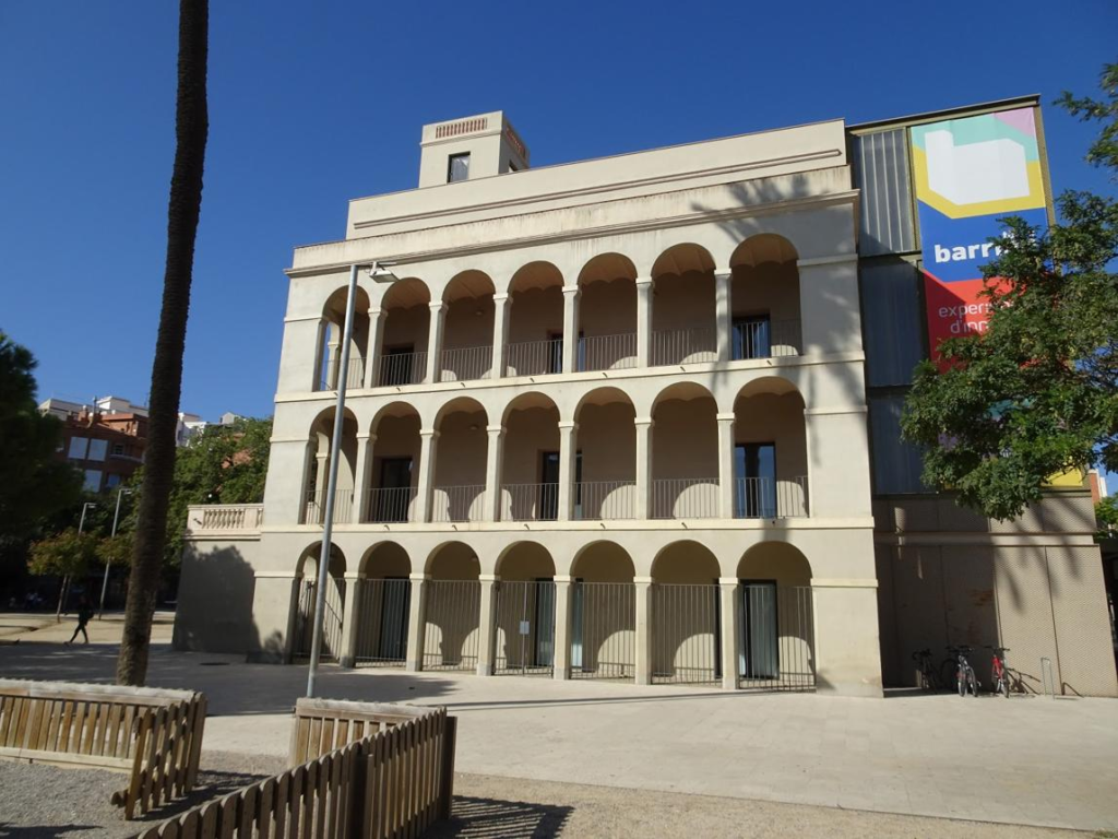 Visitors exploring Torre Barrina in L’Hospitalet de Llobregat, Spain, a cultural and historical museum.