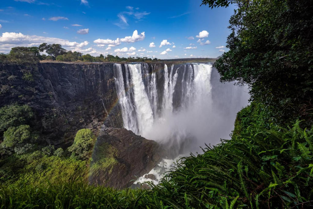 A breathtaking panorama of one of the world's largest waterfalls, surrounded by rainforest and dramatic gorges.